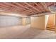 Unfinished basement area with exposed ceiling insulation and carpet flooring with stairs at 537 Pine Shadows Dr, Dallas, GA 30157