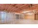 Large basement with concrete flooring, partially framed walls, and exposed ceiling for flexible design at 537 Pine Shadows Dr, Dallas, GA 30157