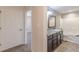 Bathroom view with vanity and wood floors with hallway and bedroom visible in background at 537 Pine Shadows Dr, Dallas, GA 30157