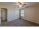 Lovely bedroom featuring a closet, ceiling fan, and a window with natural light and neutral walls and carpet at 537 Pine Shadows Dr, Dallas, GA 30157