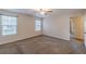 Light filled bedroom featuring neutral walls, carpet flooring and two windows at 537 Pine Shadows Dr, Dallas, GA 30157