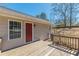 Picture of the wooden deck, exterior siding, and red door at 537 Pine Shadows Dr, Dallas, GA 30157