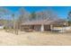 Exterior home view showcasing a carport, fenced-in yard, and charming curb appeal at 537 Pine Shadows Dr, Dallas, GA 30157