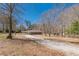 Beautiful exterior of the home with a gravel driveway at 537 Pine Shadows Dr, Dallas, GA 30157