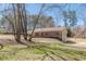 Exterior of home with covered porch and basement garage at 537 Pine Shadows Dr, Dallas, GA 30157