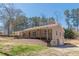 Exterior elevation of home with an expansive porch at 537 Pine Shadows Dr, Dallas, GA 30157