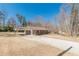 Home exterior featuring covered parking and a porch at 537 Pine Shadows Dr, Dallas, GA 30157