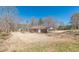 Sprawling backyard with an attached carport and a fenced-in yard, perfect for outdoor living at 537 Pine Shadows Dr, Dallas, GA 30157