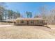 Charming ranch home with a covered front porch, large windows, and spacious yard at 537 Pine Shadows Dr, Dallas, GA 30157