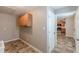 Hallway featuring access to the kitchen and utility closet at 537 Pine Shadows Dr, Dallas, GA 30157