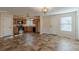 Well-lit kitchen with tile floor, wooden cabinets, and stainless steel appliances at 537 Pine Shadows Dr, Dallas, GA 30157