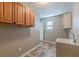 Practical laundry area equipped with cabinets, sink, and connections at 537 Pine Shadows Dr, Dallas, GA 30157