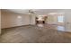 Open-concept living room featuring carpet, and tile that leads to the kitchen with stainless steel appliances at 537 Pine Shadows Dr, Dallas, GA 30157