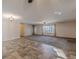 Large living area featuring a blend of carpet and tile flooring, and natural lighting at 537 Pine Shadows Dr, Dallas, GA 30157