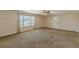 Inviting living room featuring neutral walls, large window, and access to the front door at 537 Pine Shadows Dr, Dallas, GA 30157