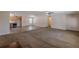 Spacious living room and open floor plan with carpet and adjacent kitchen at 537 Pine Shadows Dr, Dallas, GA 30157