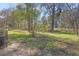 Expansive backyard with mature trees, green grass, and space for outdoor activities at 2261 Headland Ter, Atlanta, GA 30344