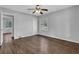 This bedroom has hardwood floors, one window and a view of an adjacent bedroom through the open door at 2261 Headland Ter, Atlanta, GA 30344