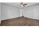 Bedroom with a ceiling fan and hardwood flooring with two full closets and a view of another room at 2261 Headland Ter, Atlanta, GA 30344
