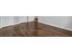 Bedroom with wood floors, wainscotting, and bright white trim at 2261 Headland Ter, Atlanta, GA 30344