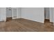 Spacious room with hardwood floors, neutral walls and access to the bathroom and dining room at 2261 Headland Ter, Atlanta, GA 30344