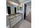 Bathroom featuring decorative lighting, granite countertops and a tile floor at 2295 Golden Valley Dr, Lawrenceville, GA 30043