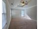 Bedroom featuring a ceiling fan, double-hung windows and a large walk-in closet at 2295 Golden Valley Dr, Lawrenceville, GA 30043