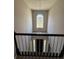 View of foyer from upstairs with high ceilings and a large window at 2295 Golden Valley Dr, Lawrenceville, GA 30043