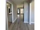 Hallway view showing the transition between rooms with light wood flooring at 2295 Golden Valley Dr, Lawrenceville, GA 30043