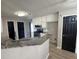 Open kitchen layout with granite countertops, stainless steel appliances, and a breakfast bar at 2295 Golden Valley Dr, Lawrenceville, GA 30043
