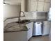 Kitchen featuring stainless steel dishwasher, granite countertops, and subway tile backsplash at 2295 Golden Valley Dr, Lawrenceville, GA 30043