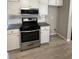 Kitchen featuring stainless steel oven and range with granite countertops at 2295 Golden Valley Dr, Lawrenceville, GA 30043