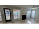 Open living room with fireplace, ceiling fan, and lots of natural light at 2295 Golden Valley Dr, Lawrenceville, GA 30043