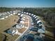 An aerial view of a new residential community with tree lines and winding streets at 3557 Bryant Meadow Cir, Buford, GA 30519
