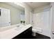 Clean bathroom featuring a single vanity with dark cabinets and a shower-tub combination at 3557 Bryant Meadow Cir, Buford, GA 30519