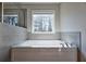 Soaking tub with large window at 3557 Bryant Meadow Cir, Buford, GA 30519