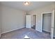 Cozy bedroom featuring neutral tones, soft carpeting, and a practical walk-in closet at 3557 Bryant Meadow Cir, Buford, GA 30519