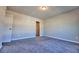 Comfortable bedroom with soft carpeting and a walk-in closet for ample storage at 3557 Bryant Meadow Cir, Buford, GA 30519