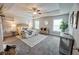 Airy main bedroom featuring neutral tones, tray ceilings, ample natural light and comfortable furniture at 3557 Bryant Meadow Cir, Buford, GA 30519