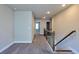 Upstairs hallway features neutral walls, carpet, white baseboards, and a banister at 3557 Bryant Meadow Cir, Buford, GA 30519