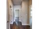 Bright hallway with wood floors leads to bedrooms showcasing the home's open floor plan at 3557 Bryant Meadow Cir, Buford, GA 30519