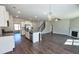 Open-concept kitchen with an island, stainless steel appliances, and seamless flow to the living area at 3557 Bryant Meadow Cir, Buford, GA 30519