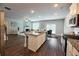 Spacious kitchen with a center island, stainless steel appliances, and an open view to the living room at 3557 Bryant Meadow Cir, Buford, GA 30519
