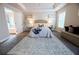 Bright main bedroom featuring tray ceilings, a large window, and ensuite bath access at 3557 Bryant Meadow Cir, Buford, GA 30519