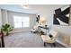 Cozy sitting room with plush chairs, modern art, and a bright window for natural light at 3557 Bryant Meadow Cir, Buford, GA 30519