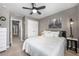 Comfortable bedroom with neutral walls, ceiling fan and ensuite bath at 4084 Elsdon Dr, Austell, GA 30106