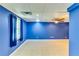 Bright blue finished basement with neutral flooring at 6921 Springbank Way, Stone Mountain, GA 30087