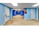 Finished basement with neutral carpeting and natural light at 6921 Springbank Way, Stone Mountain, GA 30087