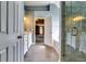 Light filled bathroom featuring double sinks, walk-in shower, garden tub, and marble countertops at 6921 Springbank Way, Stone Mountain, GA 30087