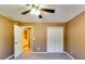 Neutral bedroom showcasing closet and entry to bath at 6921 Springbank Way, Stone Mountain, GA 30087